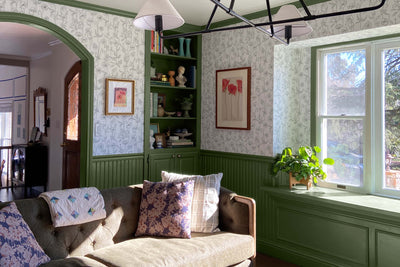Bright Trim Adds the Perfect Finishing Touch in this Green Living Room