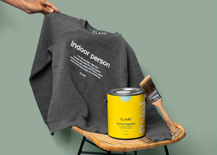 Prepare to get comfy in this cozy gray sweatshirt! This screen printed, unisex fleece crewneck is perfect for lounging and made with the homebody in mind.